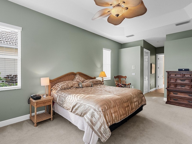 bedroom with light carpet and ceiling fan