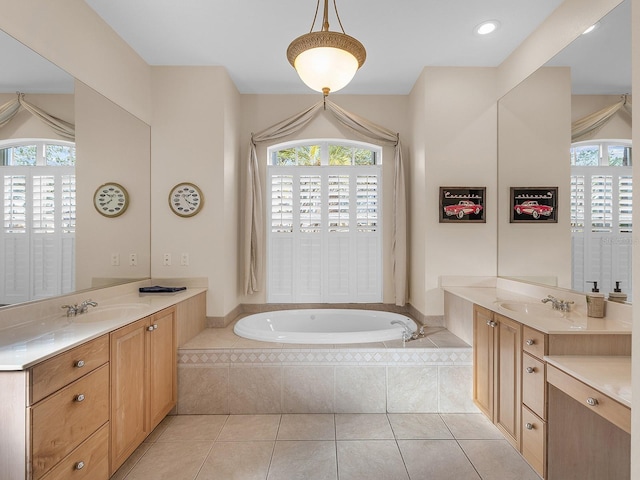 bathroom featuring vanity, tile patterned flooring, and a healthy amount of sunlight