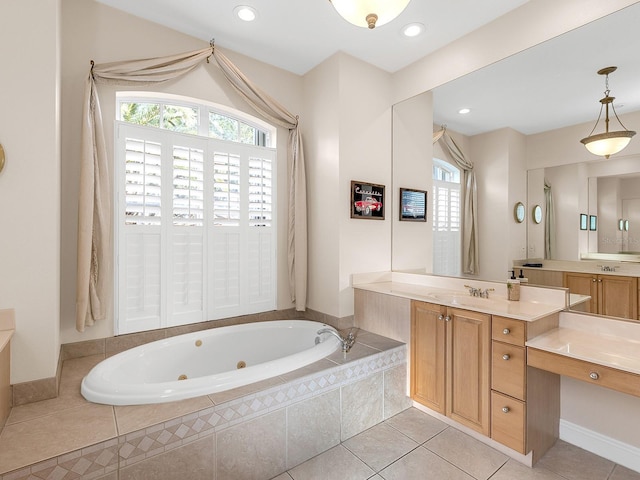 bathroom with a relaxing tiled tub, tile patterned floors, and vanity