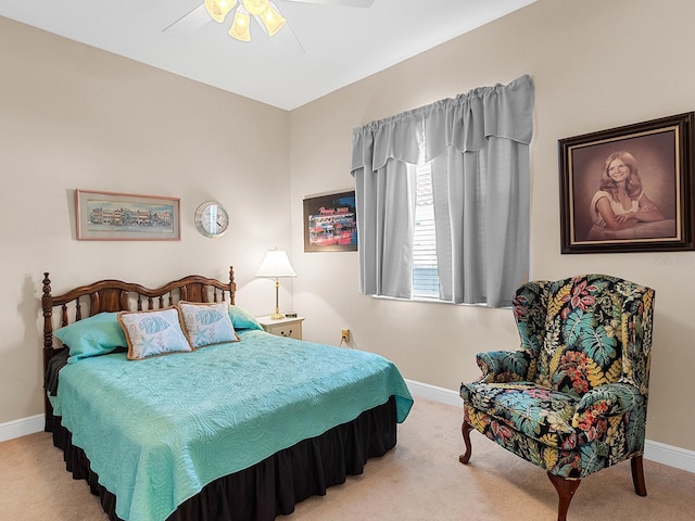 bedroom with light colored carpet and ceiling fan