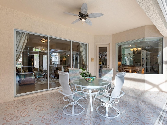 view of patio featuring ceiling fan