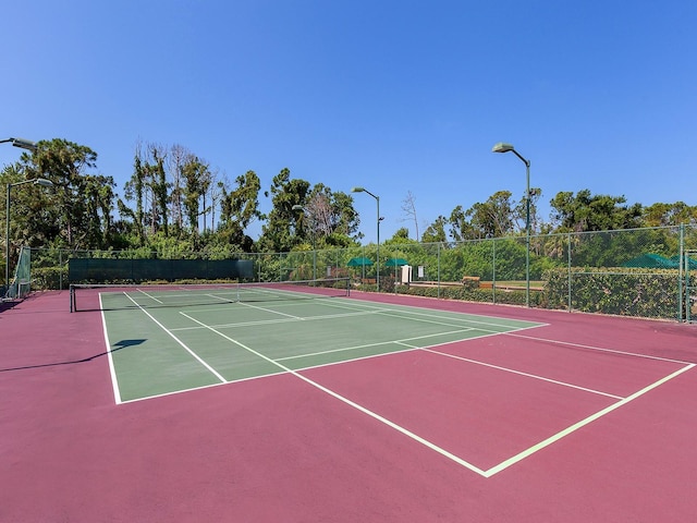 view of tennis court featuring basketball court