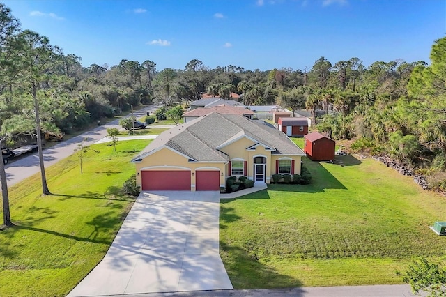 bird's eye view featuring a wooded view