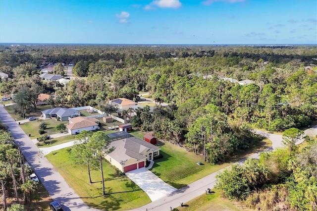 aerial view featuring a wooded view