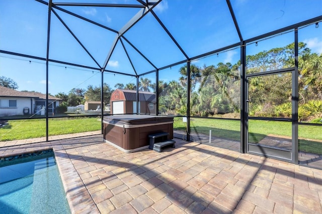 exterior space featuring a hot tub, a lanai, a storage unit, an outdoor structure, and a pool