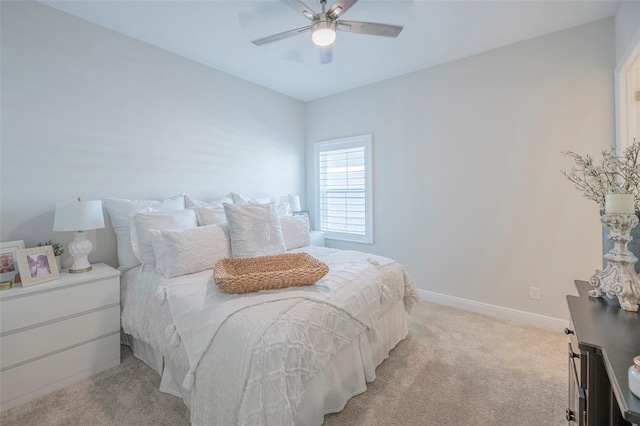 bedroom featuring ceiling fan and light colored carpet