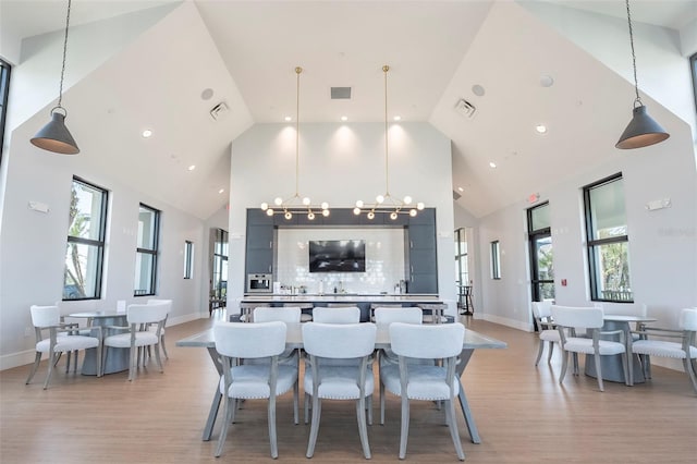 kitchen with decorative light fixtures and light wood-type flooring