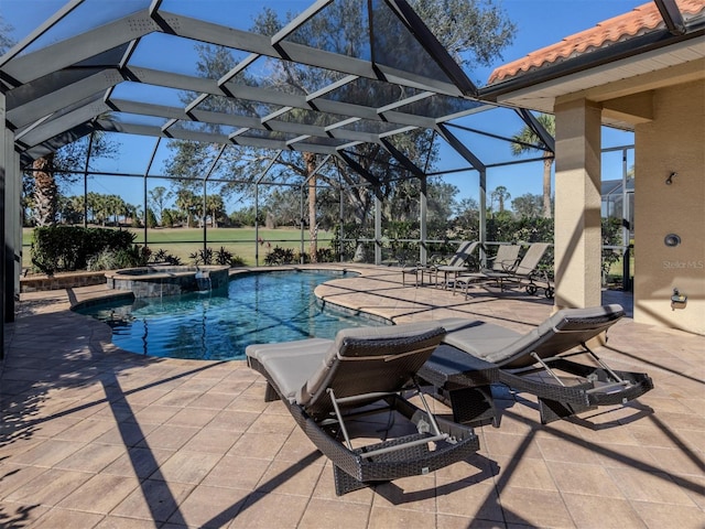 view of swimming pool featuring an in ground hot tub, a lanai, and a patio area