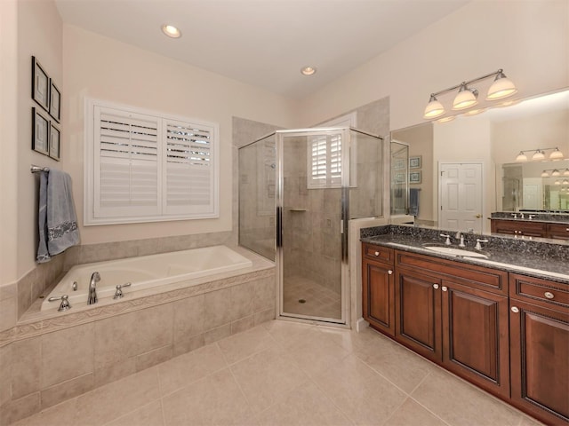 bathroom featuring vanity, tile patterned floors, and independent shower and bath