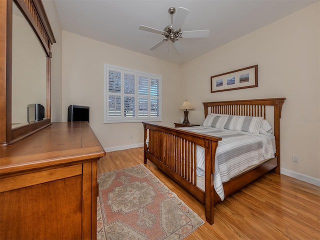 bedroom with ceiling fan and light hardwood / wood-style floors