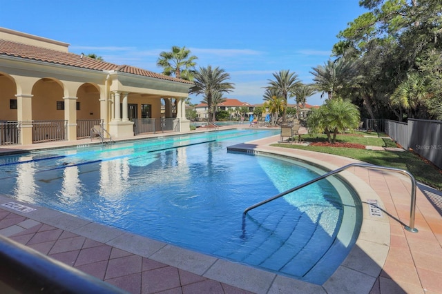 view of swimming pool featuring a patio area