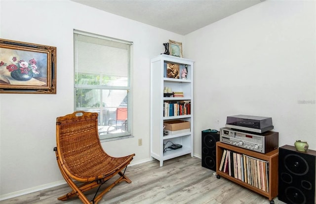 sitting room with light hardwood / wood-style flooring