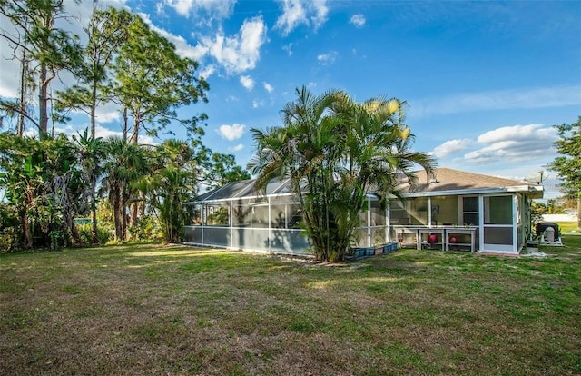 view of yard featuring glass enclosure