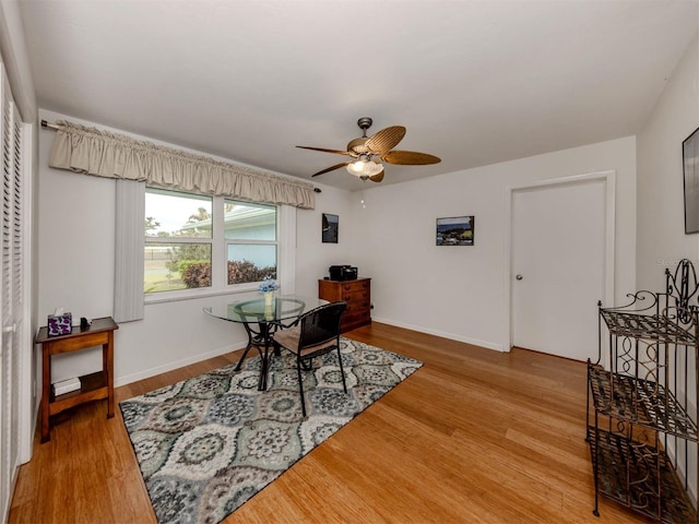 home office featuring hardwood / wood-style floors and ceiling fan