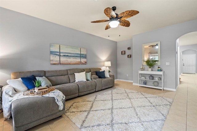 tiled living room with ceiling fan