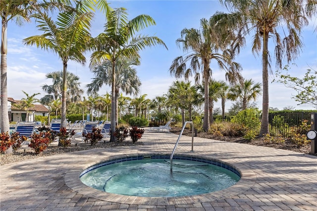 view of swimming pool featuring a community hot tub