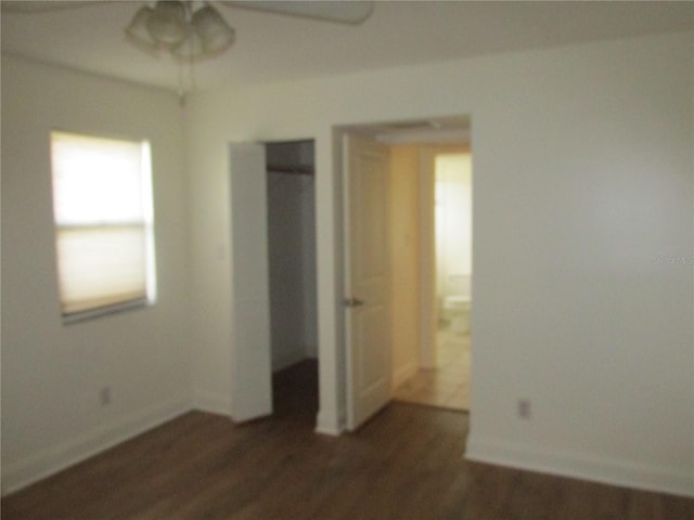 unfurnished bedroom featuring dark wood-type flooring