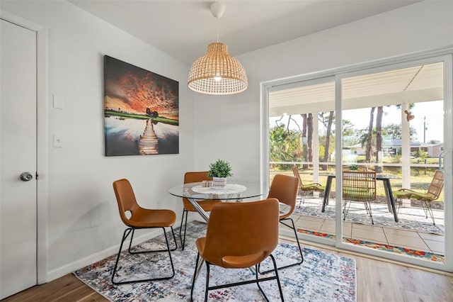 dining area with hardwood / wood-style flooring