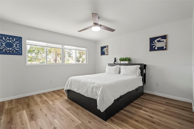 bedroom featuring wood-type flooring and ceiling fan