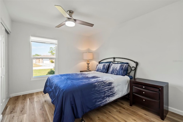 bedroom featuring a closet, ceiling fan, and light hardwood / wood-style flooring