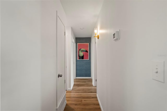 corridor featuring hardwood / wood-style floors