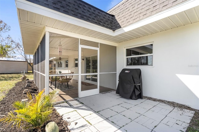 view of patio featuring a sunroom