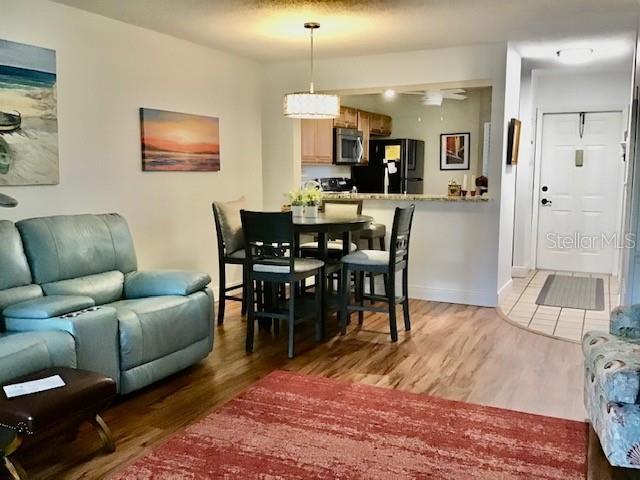 dining space with light wood-type flooring