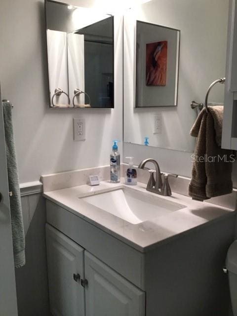 bathroom with vanity and toilet