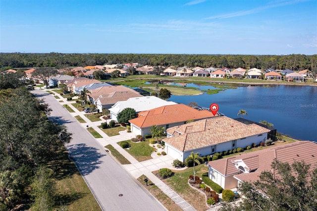 drone / aerial view with a water view