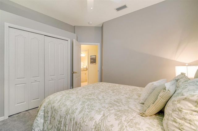 bedroom with light carpet, ceiling fan, and a closet