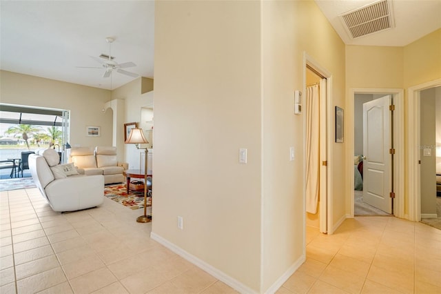 hallway featuring light tile patterned flooring