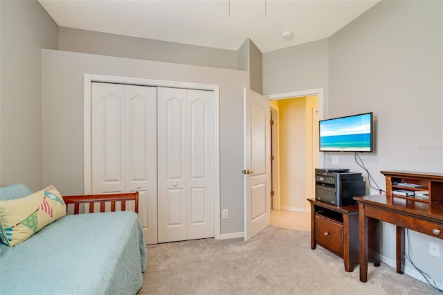 carpeted bedroom featuring a closet