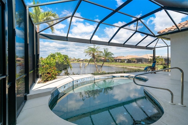 view of swimming pool with a water view, a patio, and a lanai