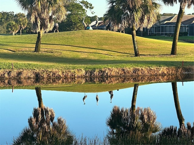 exterior space with a water view and a yard