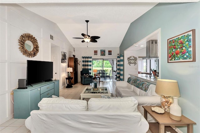 living room featuring lofted ceiling and ceiling fan