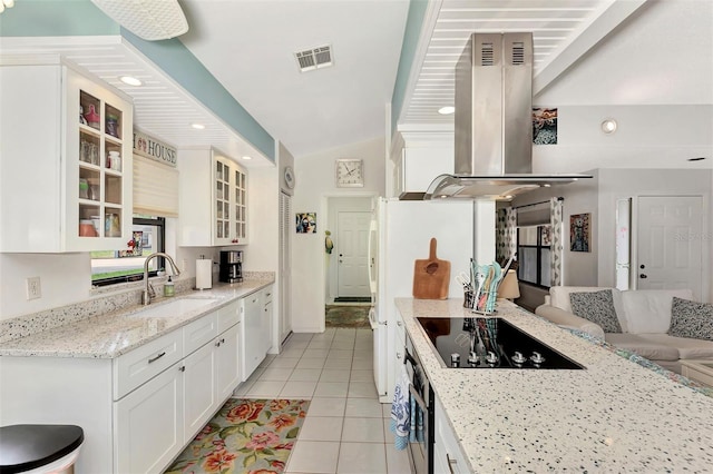 kitchen featuring island range hood, sink, white cabinets, black electric stovetop, and light stone counters