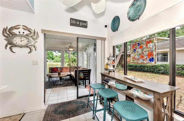 dining room featuring ceiling fan and light tile patterned floors