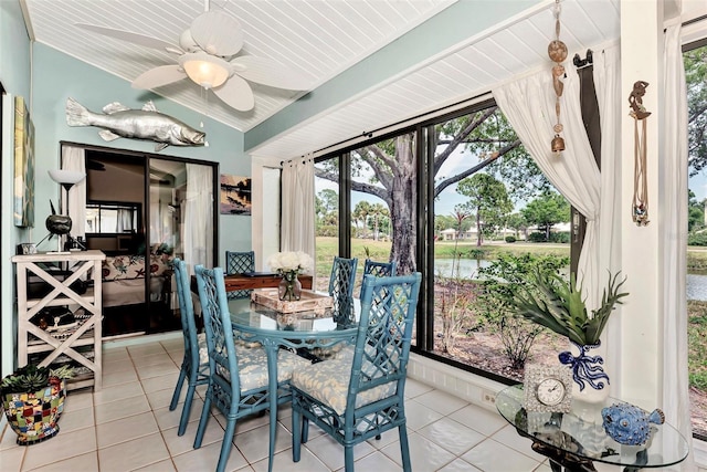 dining area with light tile patterned flooring and ceiling fan