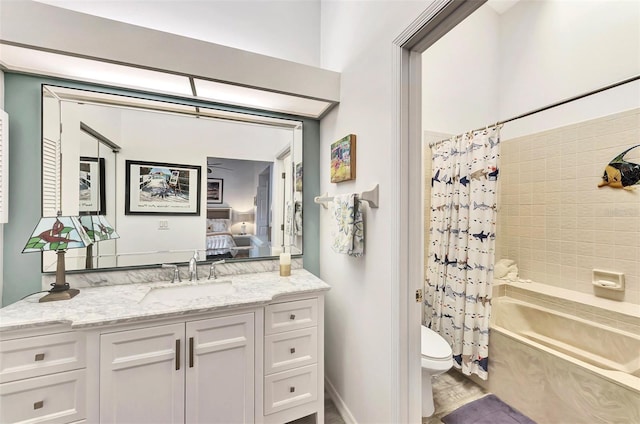 full bathroom with shower / tub combo with curtain, vanity, and toilet