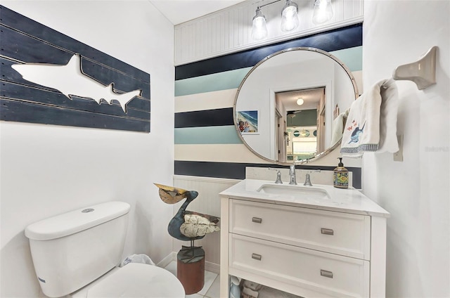 bathroom featuring vanity and toilet