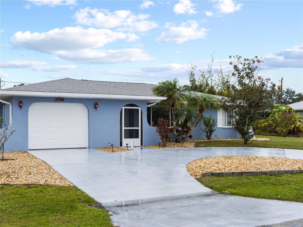 ranch-style home featuring a garage