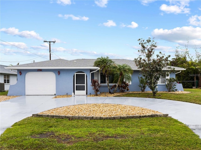 ranch-style house featuring a garage and a front lawn