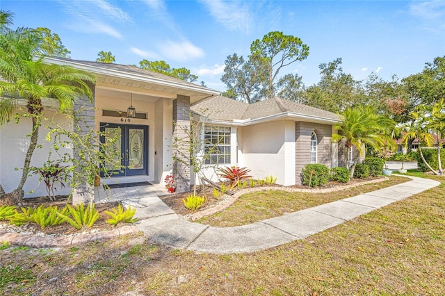 doorway to property featuring a yard