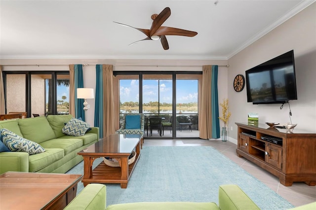 living room with crown molding, ceiling fan, and light tile patterned floors