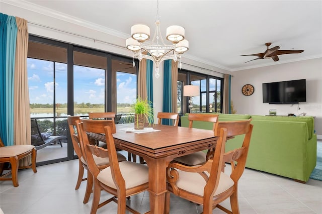 tiled dining space with a water view, ornamental molding, and ceiling fan with notable chandelier