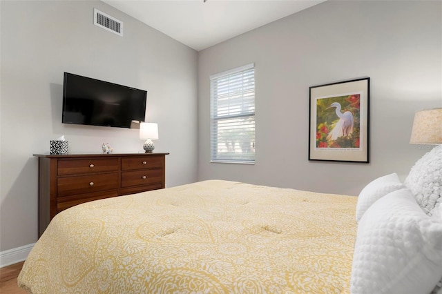 bedroom with hardwood / wood-style floors