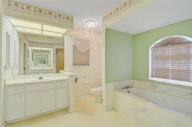 full bathroom with vanity, toilet, and separate shower and tub