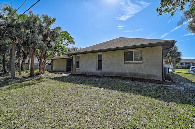 back of house with a yard