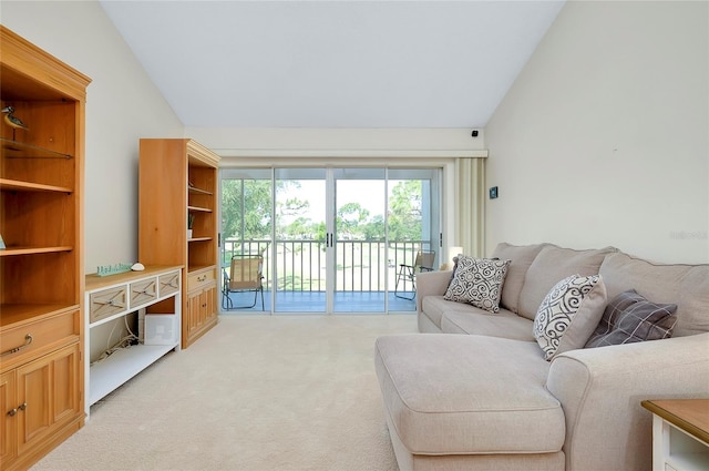 carpeted living room with lofted ceiling