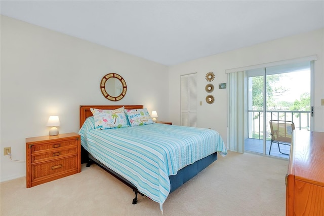 bedroom featuring light colored carpet, access to exterior, and a closet